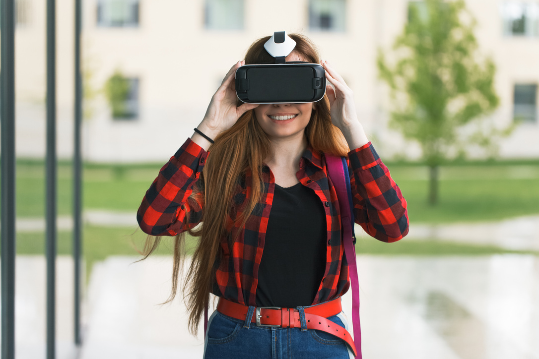 Woman with VR Glasses at College Campus